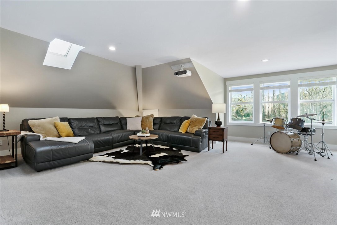 4458 Preston-Fall City Road Southeast Fall City, WA 98024 - Photo 26 of 40 a living room with furniture and a large window