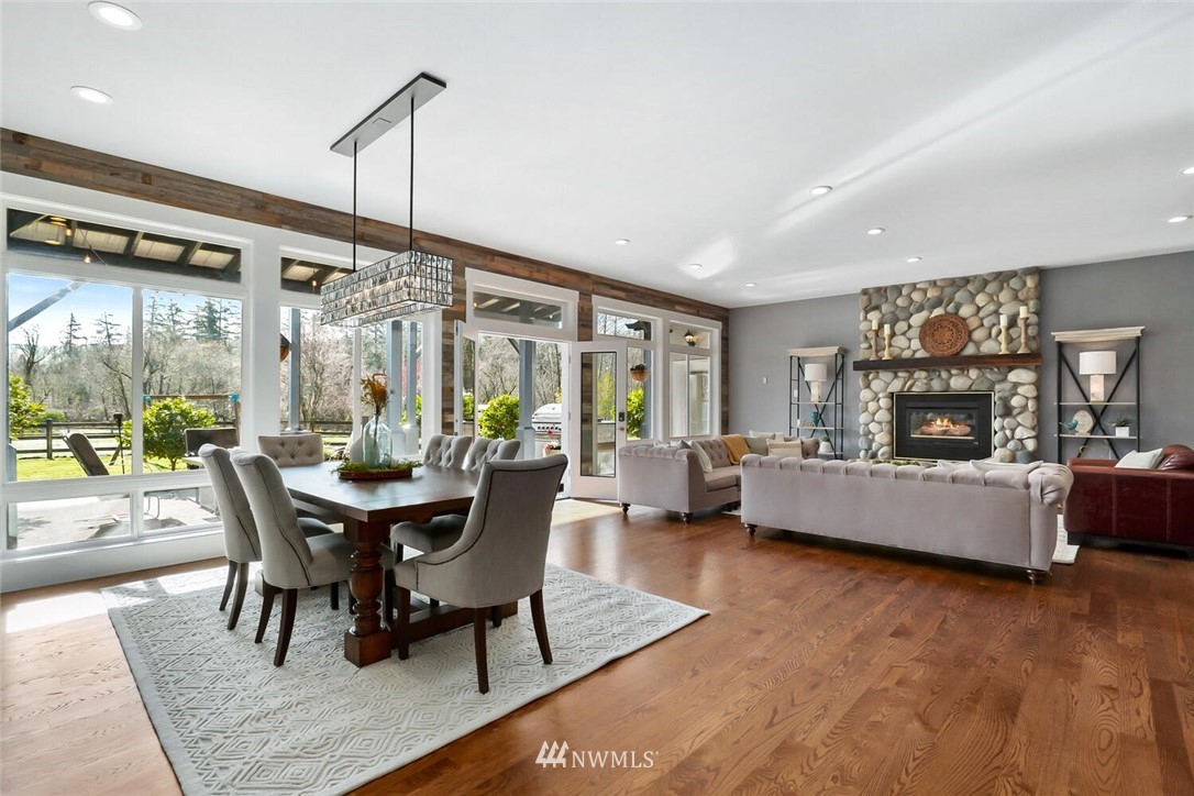 4458 Preston-Fall City Road Southeast Fall City, WA 98024 - Photo 4 of 40 a dining room with furniture and wooden floor