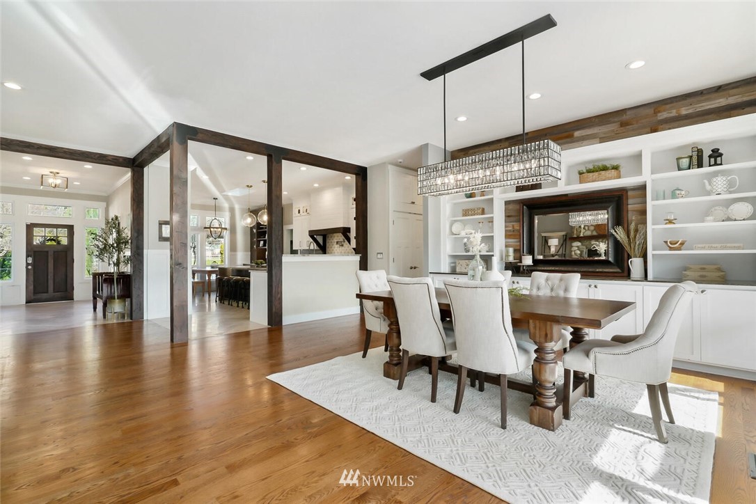 4458 Preston-Fall City Road Southeast Fall City, WA 98024 - Photo 5 of 40 a view of a dining room with furniture a rug and wooden floor