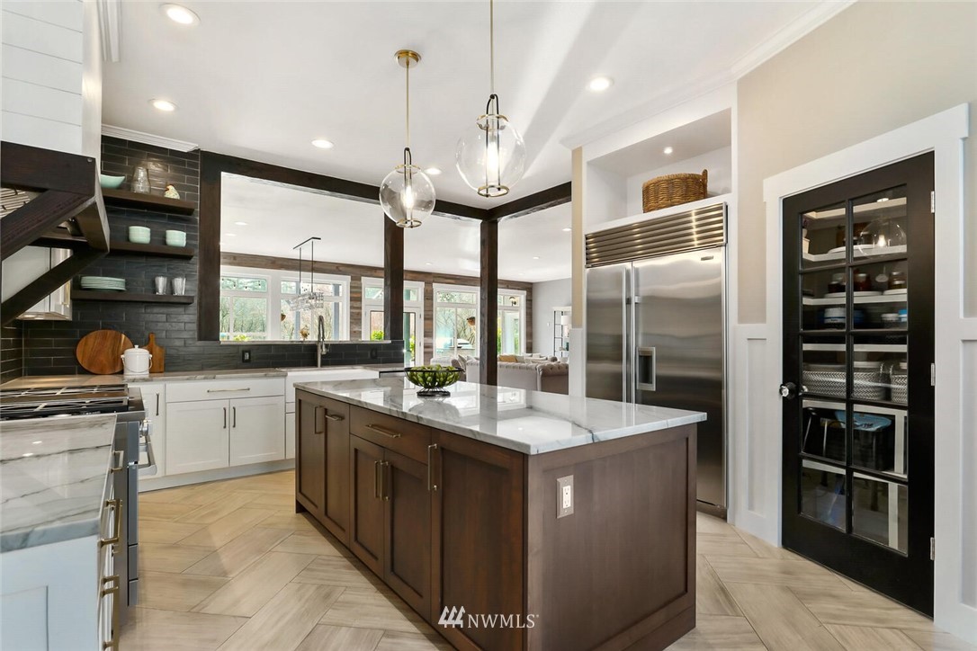 4458 Preston-Fall City Road Southeast Fall City, WA 98024 - Photo 10 of 40 a kitchen with stainless steel appliances granite countertop a sink and a refrigerator