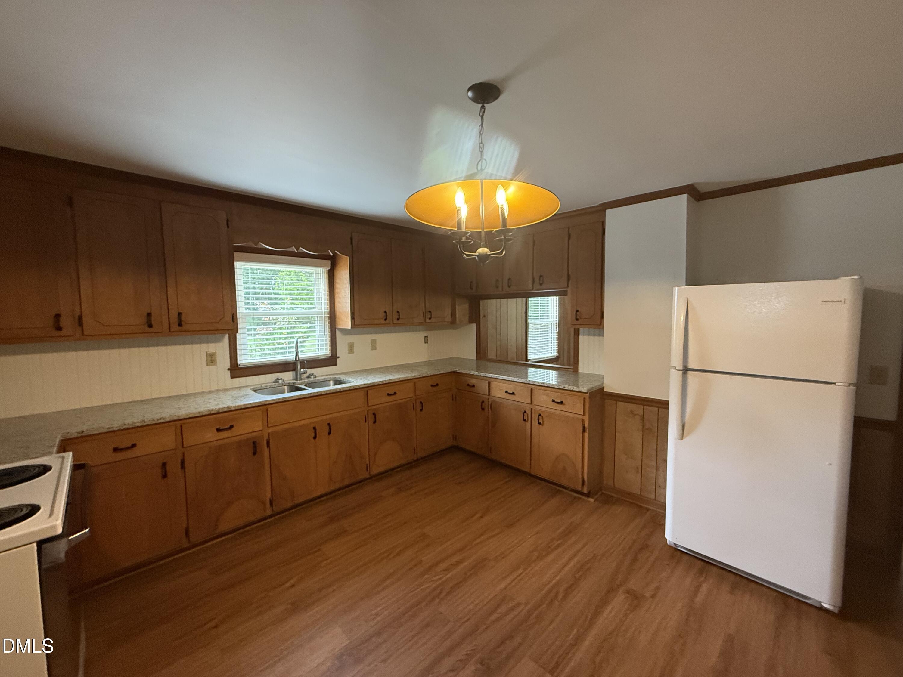 2005 Flat Rock Church Road Youngsville, NC 27596 - Photo 12 of 21 a kitchen with a wooden floor cabinets and a table