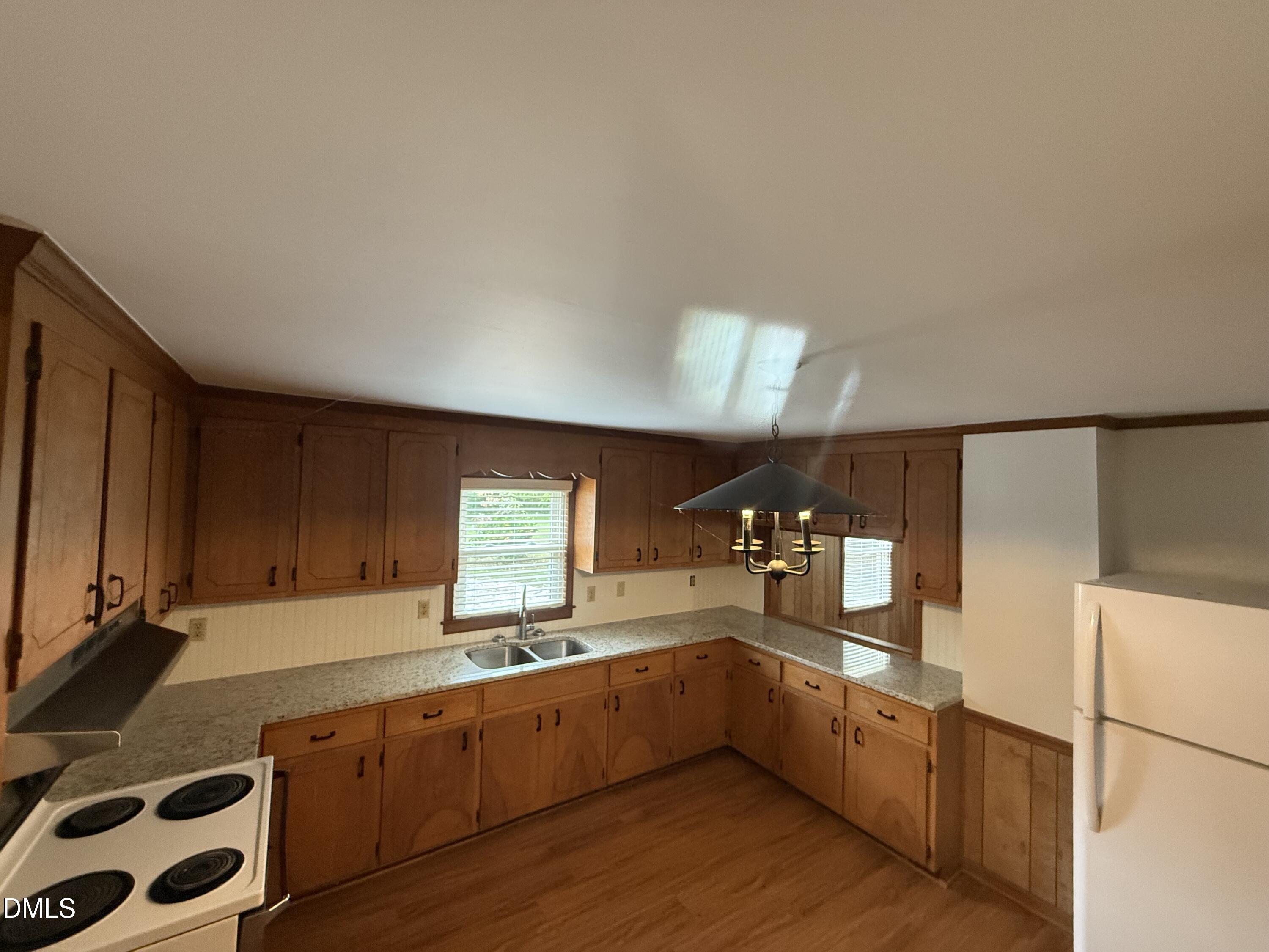 2005 Flat Rock Church Road Youngsville, NC 27596 - Photo 14 of 21 a large kitchen with stainless steel appliances a large counter top and a stove