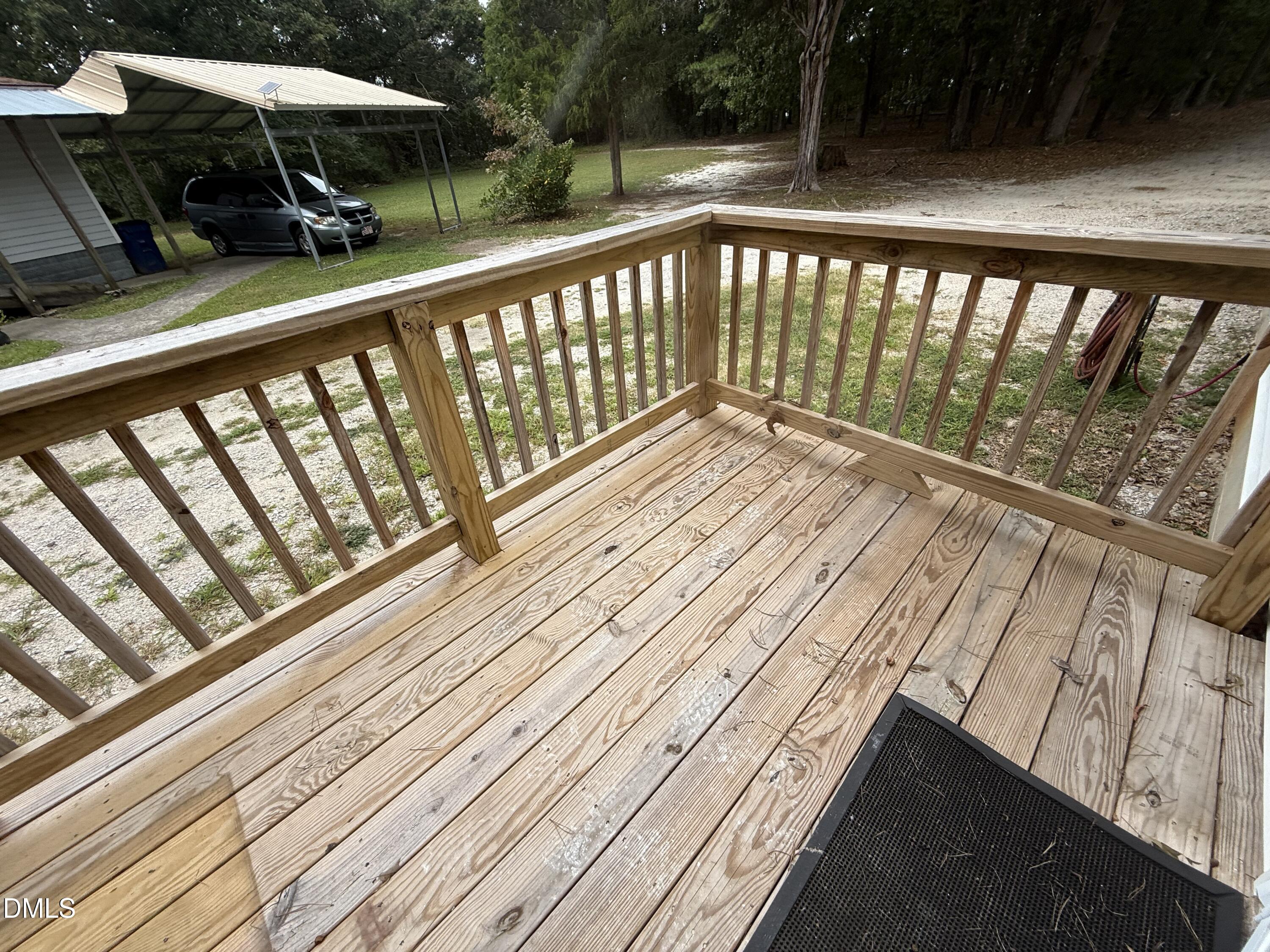 2005 Flat Rock Church Road Youngsville, NC 27596 - Photo 16 of 21 a view of balcony with wooden floor and outdoor seating