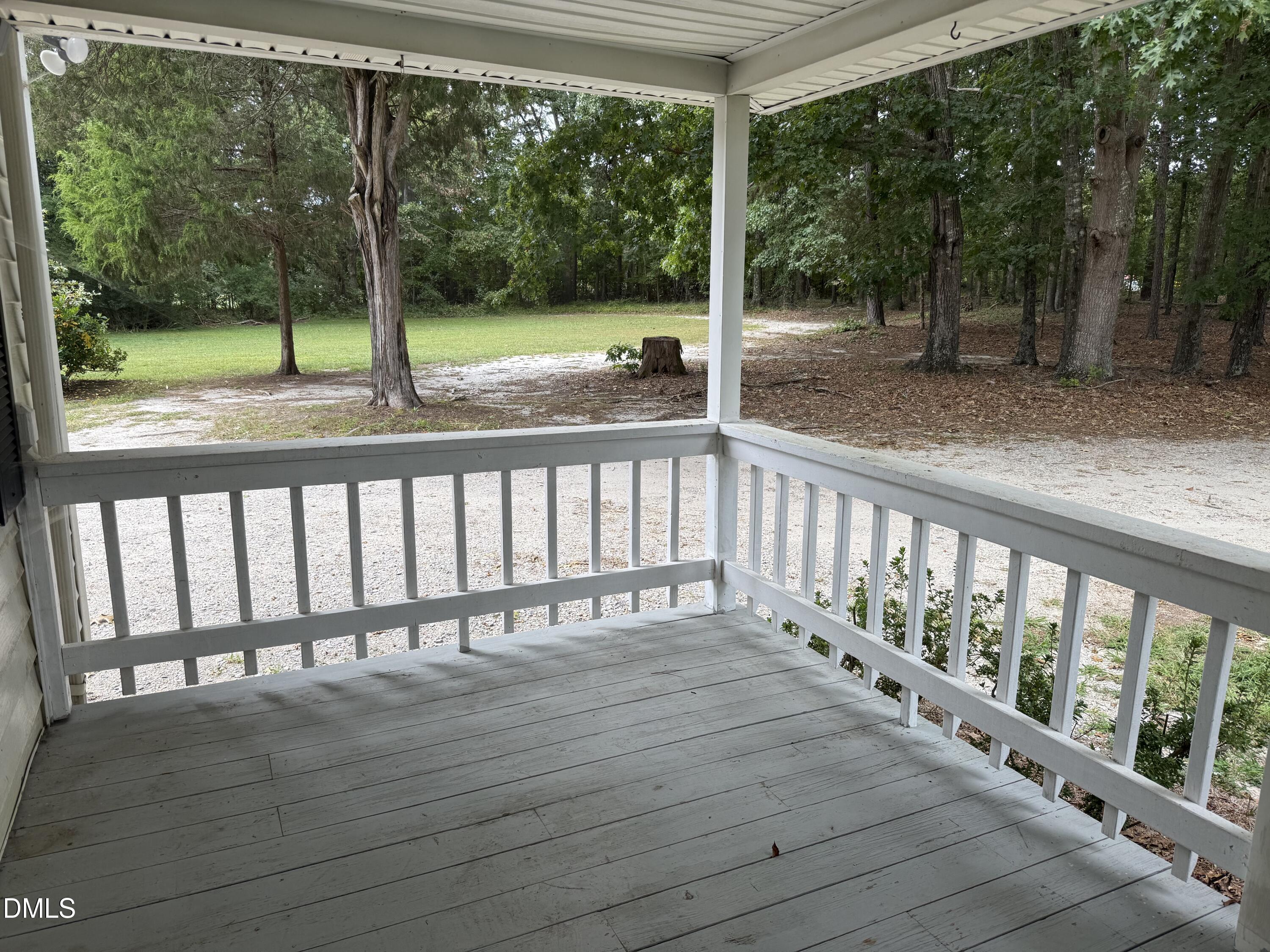 2005 Flat Rock Church Road Youngsville, NC 27596 - Photo 17 of 21 a view of a wooden deck with a yard