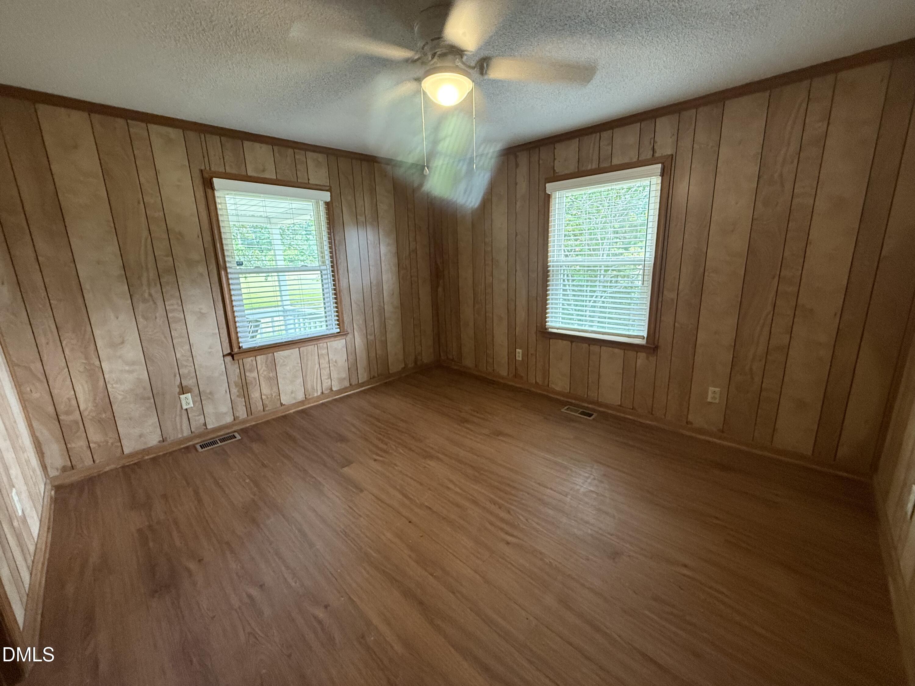 2005 Flat Rock Church Road Youngsville, NC 27596 - Photo 8 of 21 a view of an empty room with wooden floor and a window
