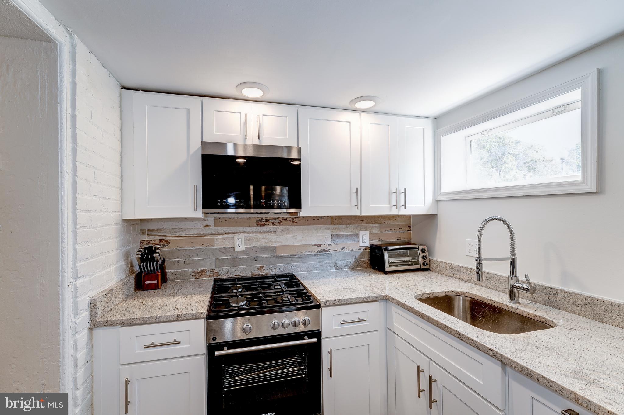 2339 3rd Street Northeast Washington, DC 20002 - Photo 27 of 59 Sunny kitchen with granite counters!