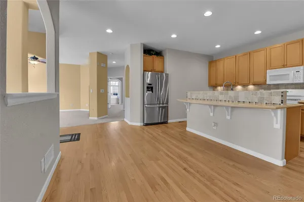 a view of kitchen with cabinets and stainless steel appliances