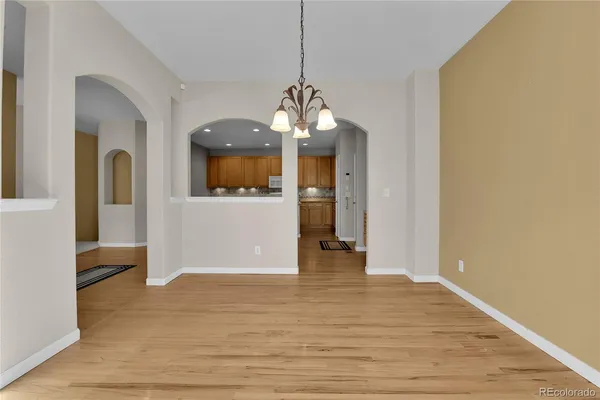 a view of a room with wooden floor and staircase