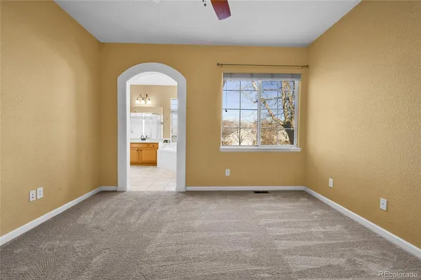 an empty room with windows and natural view