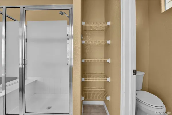 a bathroom with a glass shower door