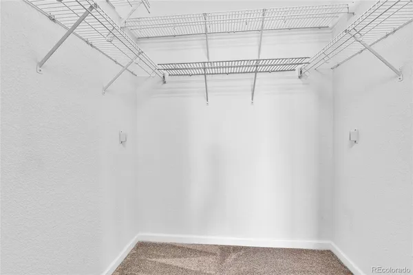 a view of a room with racks on the wall