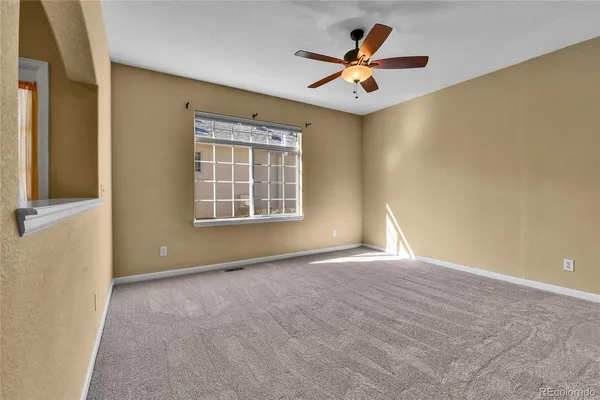 a view of an empty room with a window