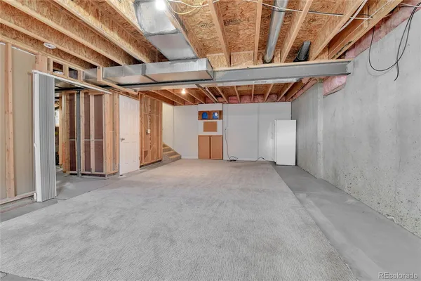 a view of empty room with stairs