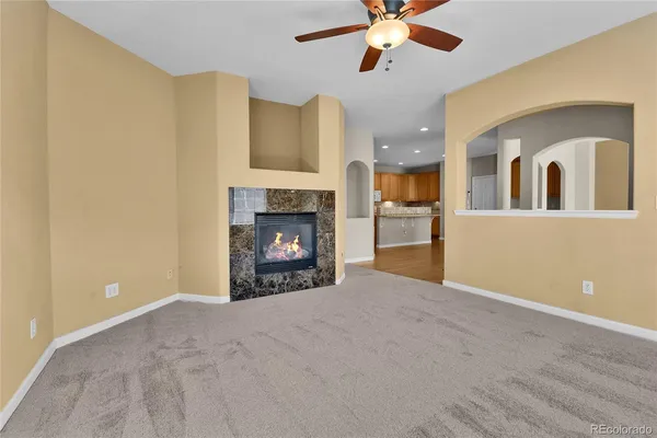 a view of an empty room with a fireplace