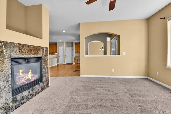 a view of an empty room with a fireplace