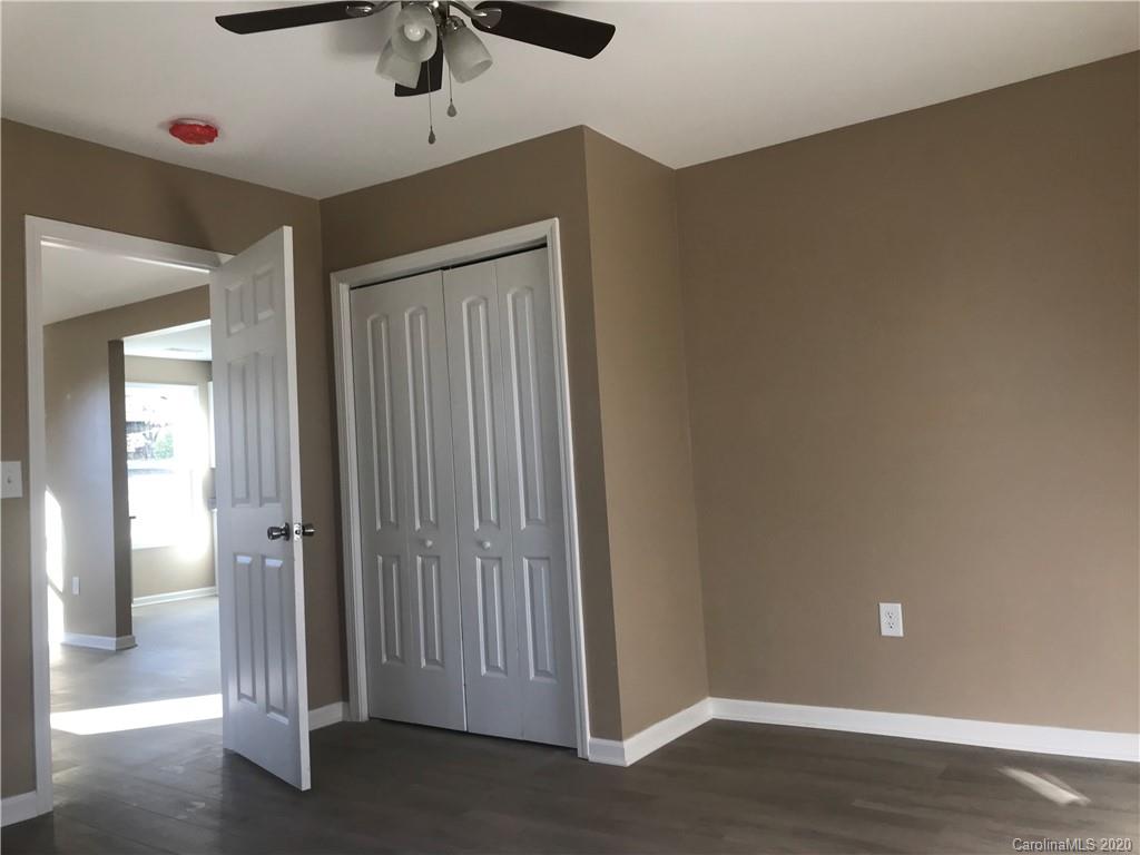 1507 Riley Street Albemarle, NC 28001 - Photo 11 of 26 a view of a hallway with wooden floor