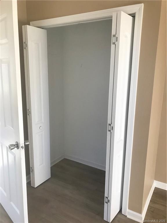 1507 Riley Street Albemarle, NC 28001 - Photo 12 of 26 a view of a hallway with wooden floor