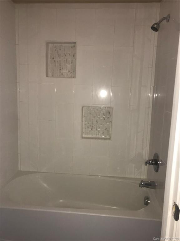 1507 Riley Street Albemarle, NC 28001 - Photo 19 of 26 a bathroom with a bathtub
