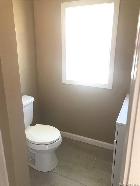 1507 Riley Street Albemarle, NC 28001 - Photo 20 of 26 a white toilet sitting next to a window