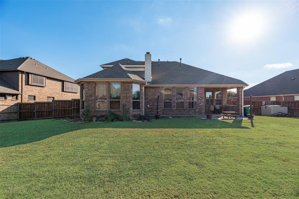 1010 Newington Circle Forney, TX 75126 - Photo 26 of 26 a front view of a house with garden