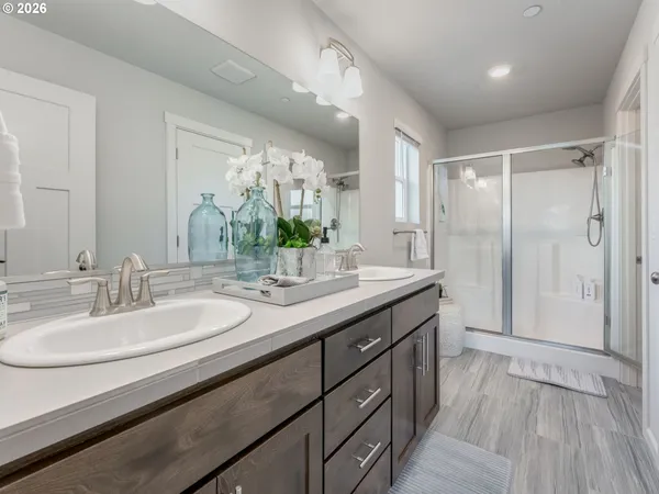 a bathroom with a sink and shower