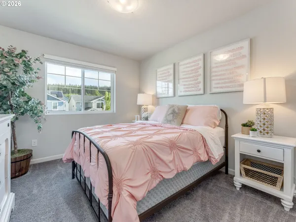 a bedroom with a bed and a mirror