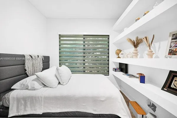 a bedroom with furniture and a bed