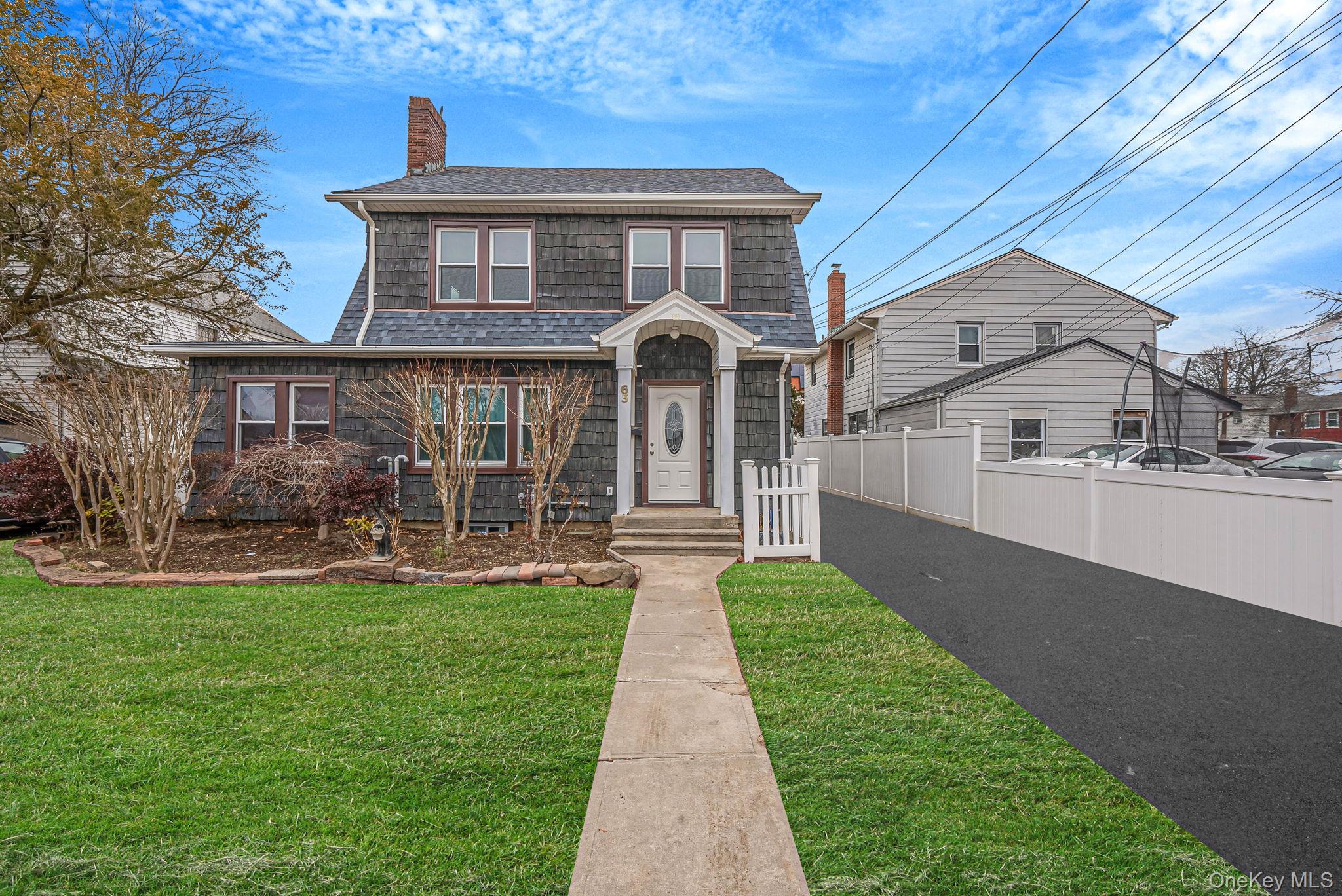 63 Devon Road Hempstead, NY 11550 - Photo 1 of 1 Front of the house. Image has been digitally enhanced.