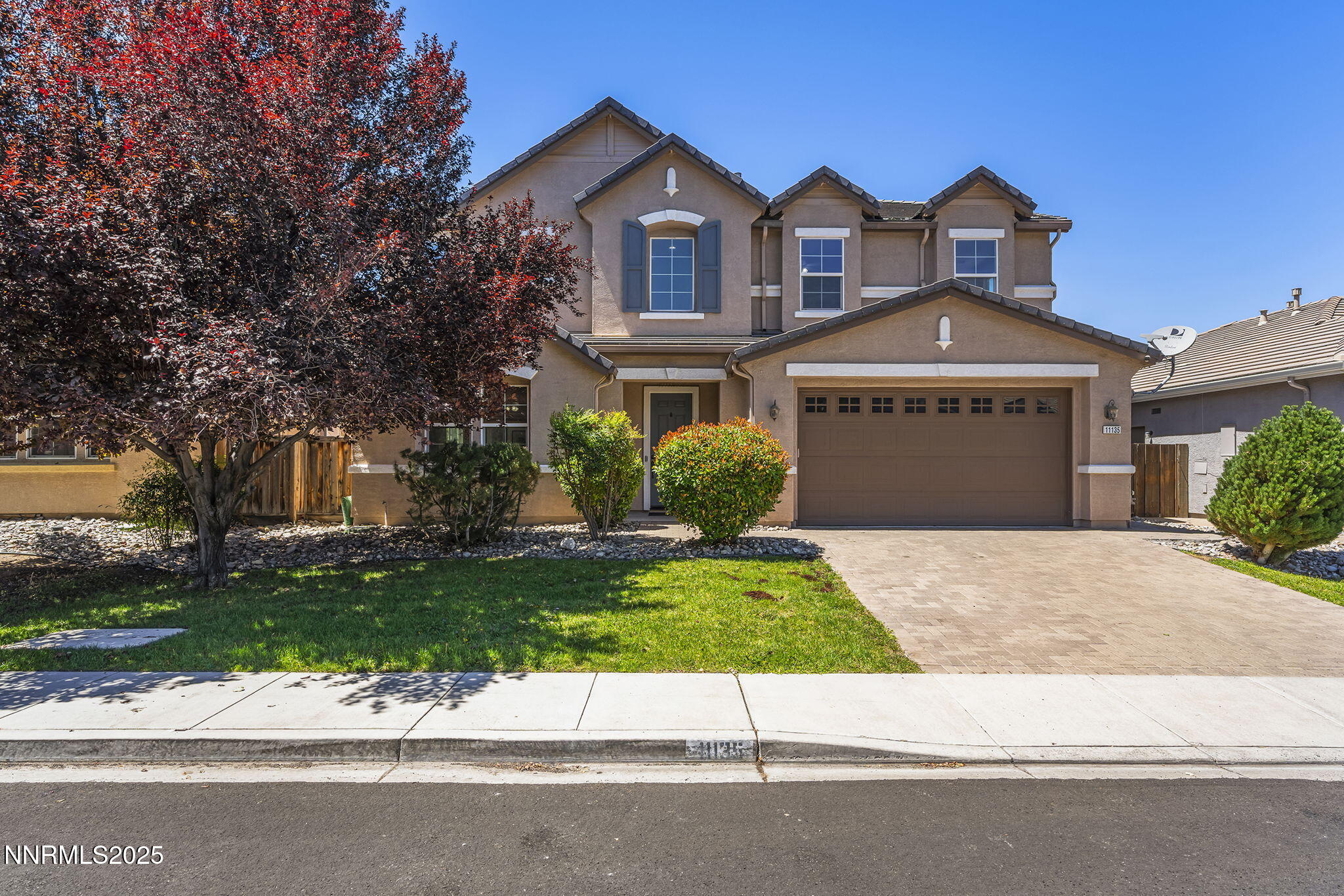 11135 Messina Way Reno, NV 89521 - Photo 1 of 31 a front view of a house with a garden and a yard