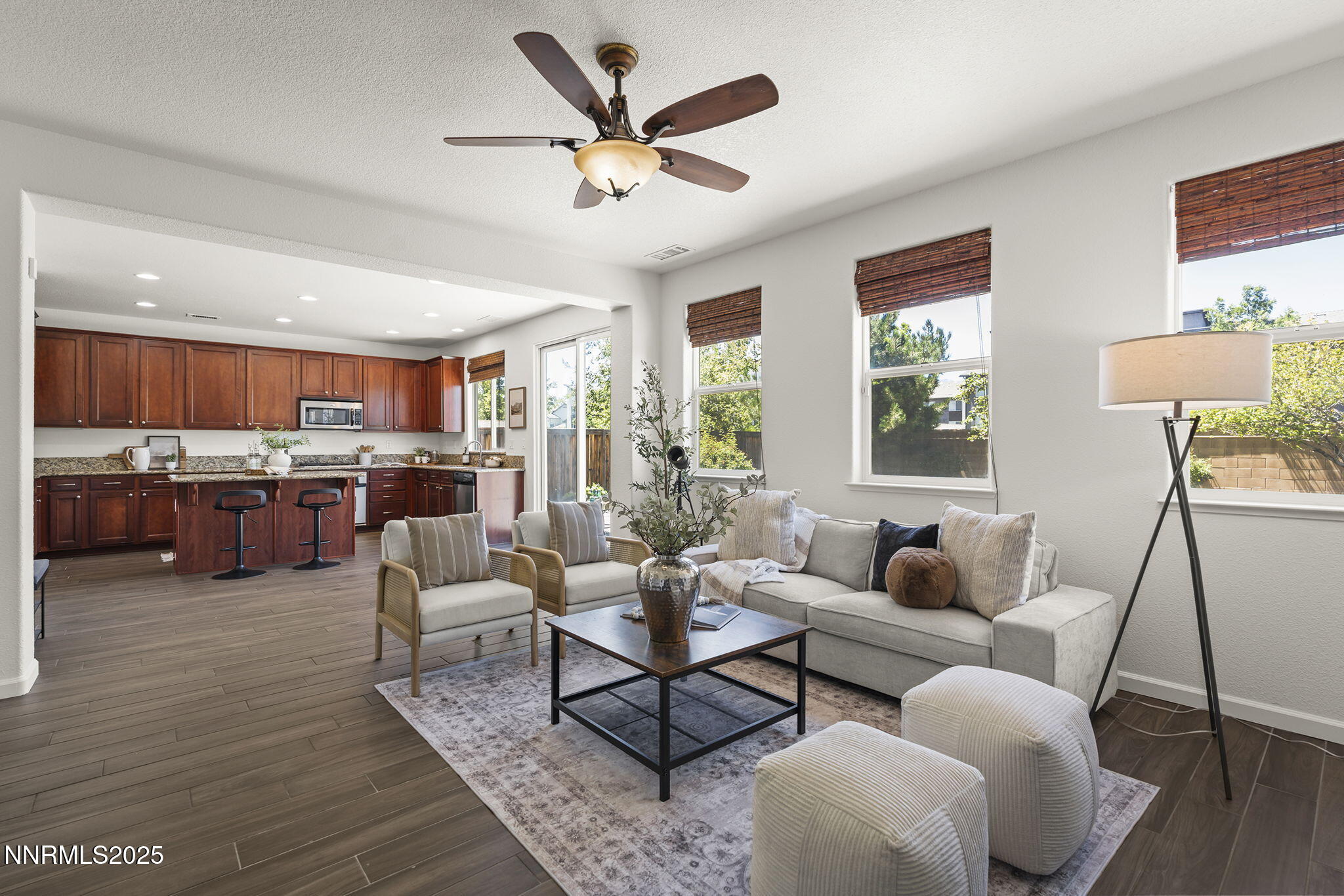 11135 Messina Way Reno, NV 89521 - Photo 15 of 31 a living room with furniture kitchen view and a large window