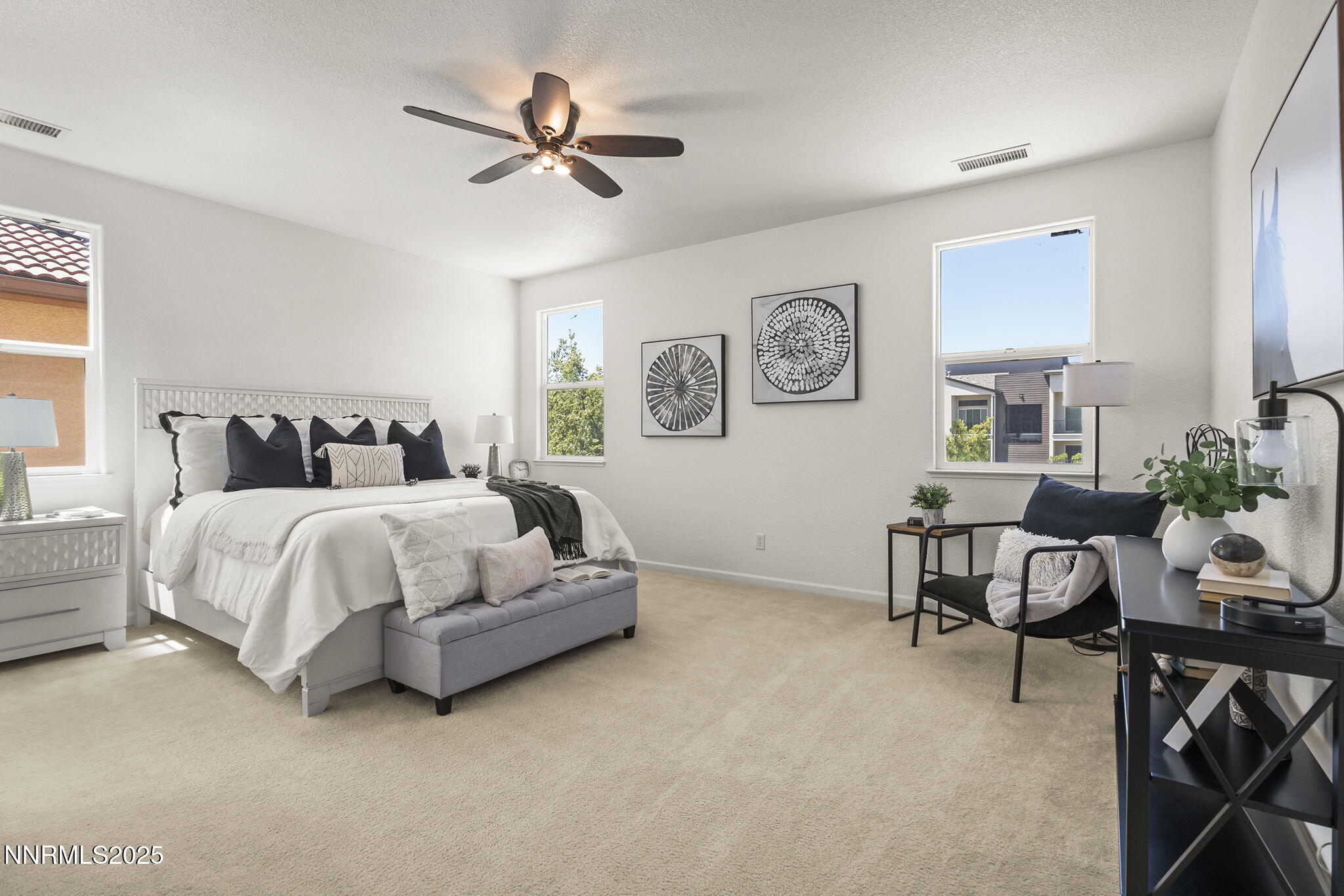 11135 Messina Way Reno, NV 89521 - Photo 19 of 31 a bedroom with a bed a desk and chair