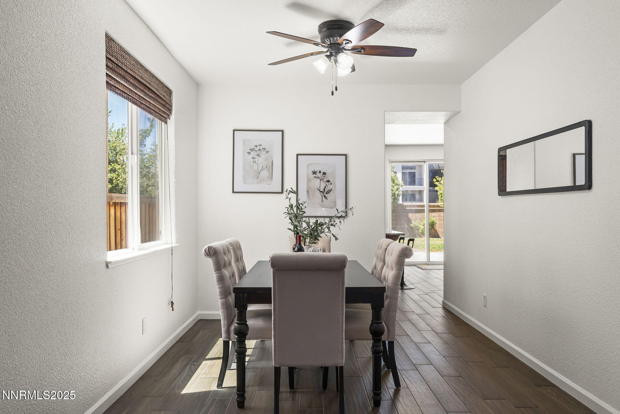 11135 Messina Way Reno, NV 89521 - Photo 7 of 31 a view of a dining room with furniture window and wooden floor