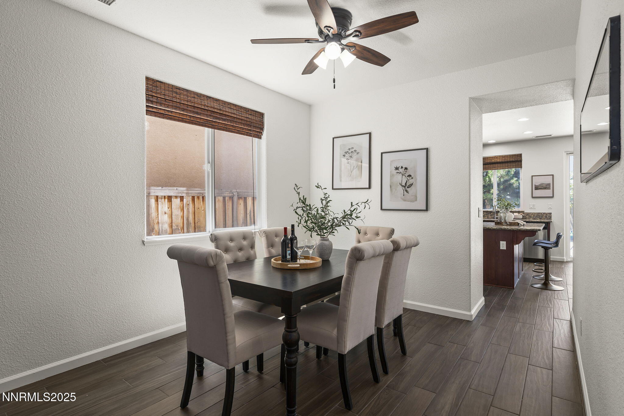 11135 Messina Way Reno, NV 89521 - Photo 8 of 31 a dining room with furniture a window and wooden floor