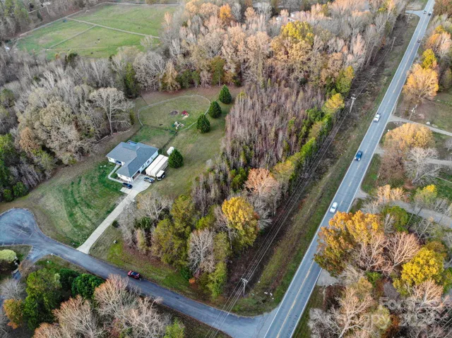 a big yard with lots of green space and deers