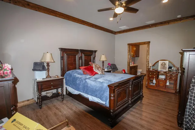 a bed room with a bed and a chandelier