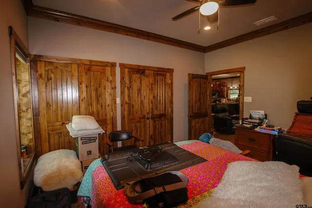 a room with furniture and wooden walls