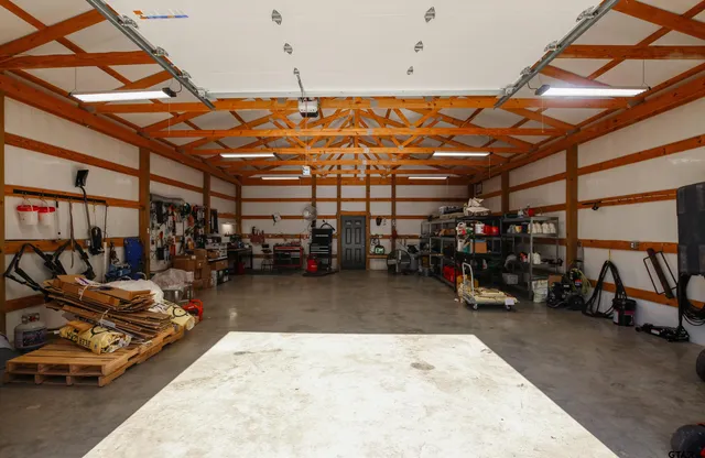 a view of a garage with a bike and wooden roof