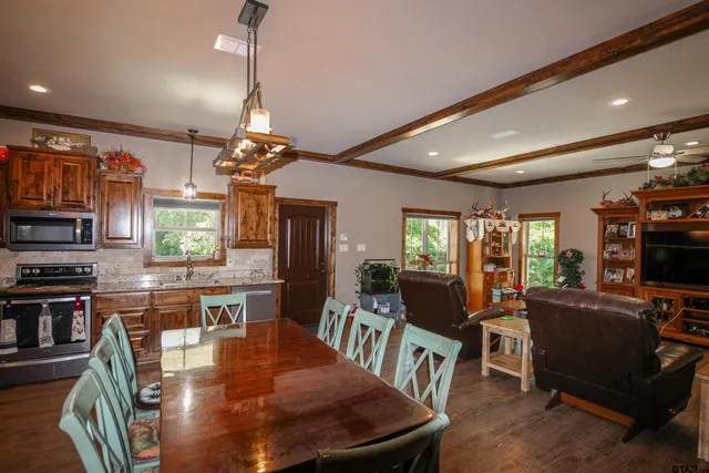 a view of a dining room with furniture window and outside view