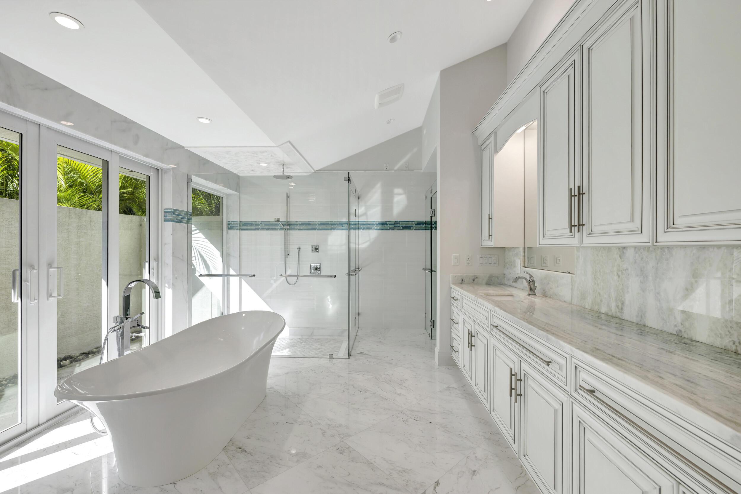 355 Oakview Drive Delray Beach, FL 33445 - Photo 13 of 92 a large white kitchen with granite countertop a large window and white appliances