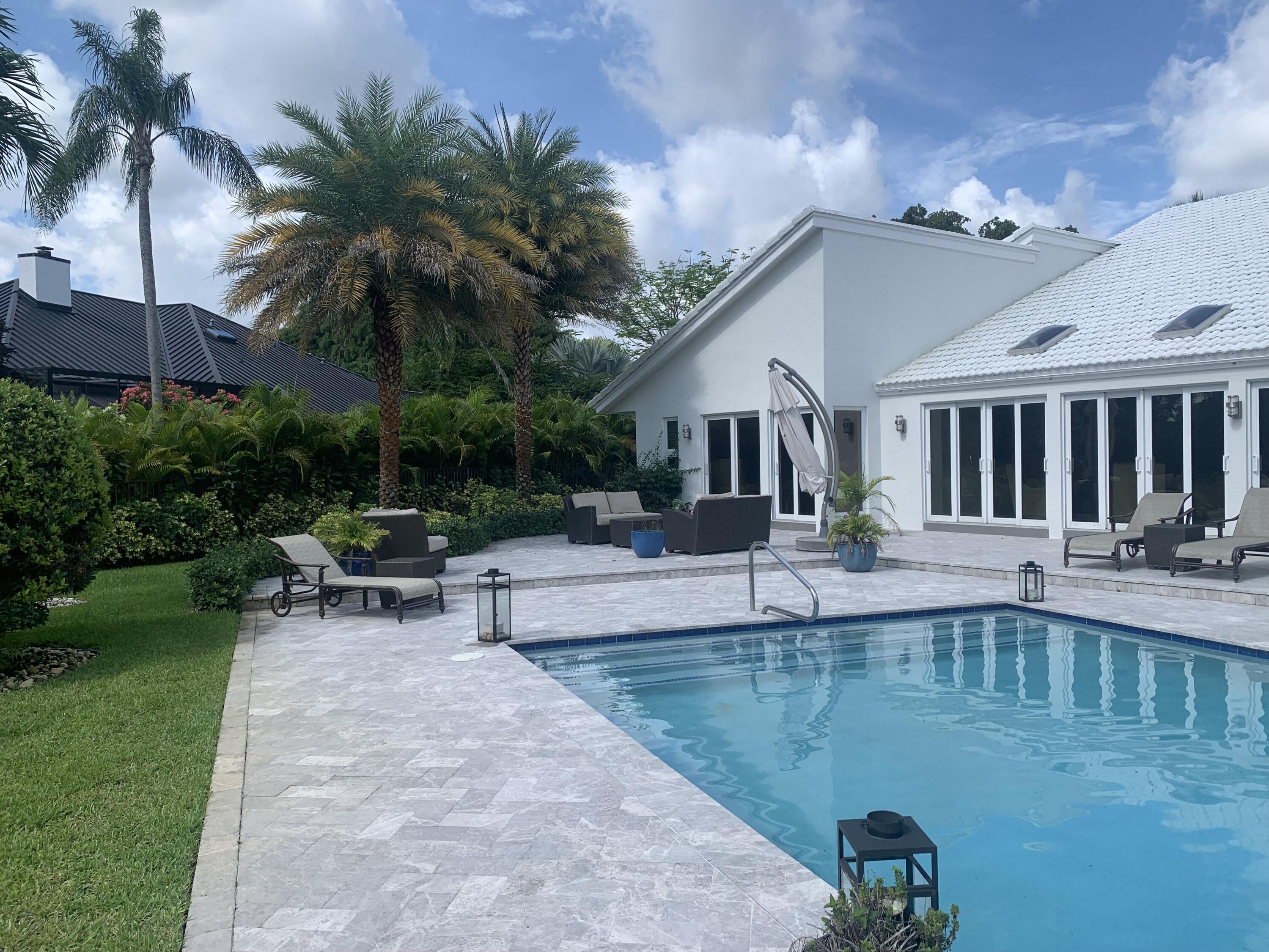355 Oakview Drive Delray Beach, FL 33445 - Photo 18 of 92 a view of a house with backyard patio and swimming pool