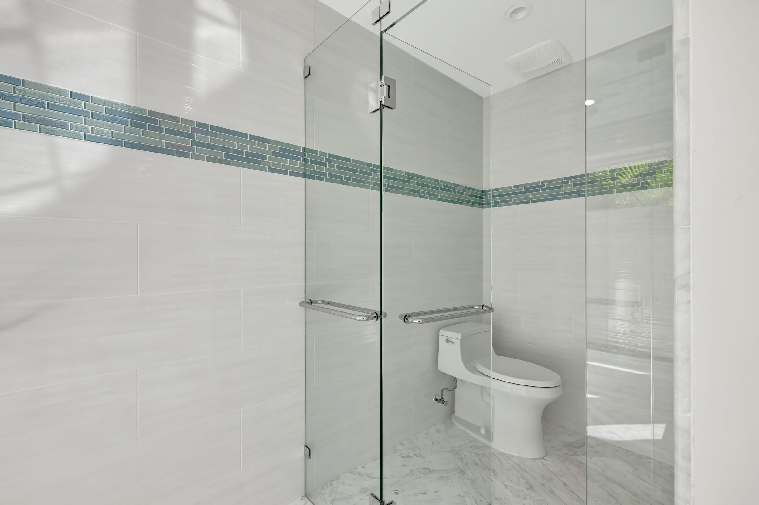 355 Oakview Drive Delray Beach, FL 33445 - Photo 47 of 92 a bathroom with a toilet and a shower