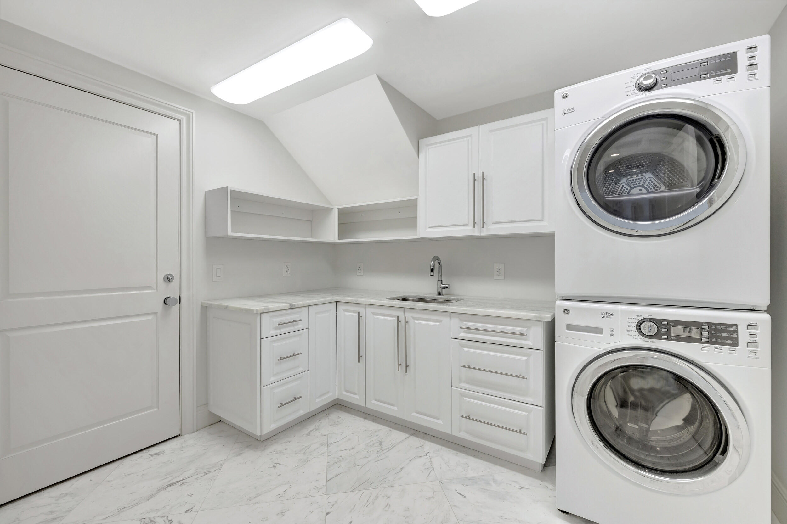 355 Oakview Drive Delray Beach, FL 33445 - Photo 56 of 92 a utility room with sink dryer and washer
