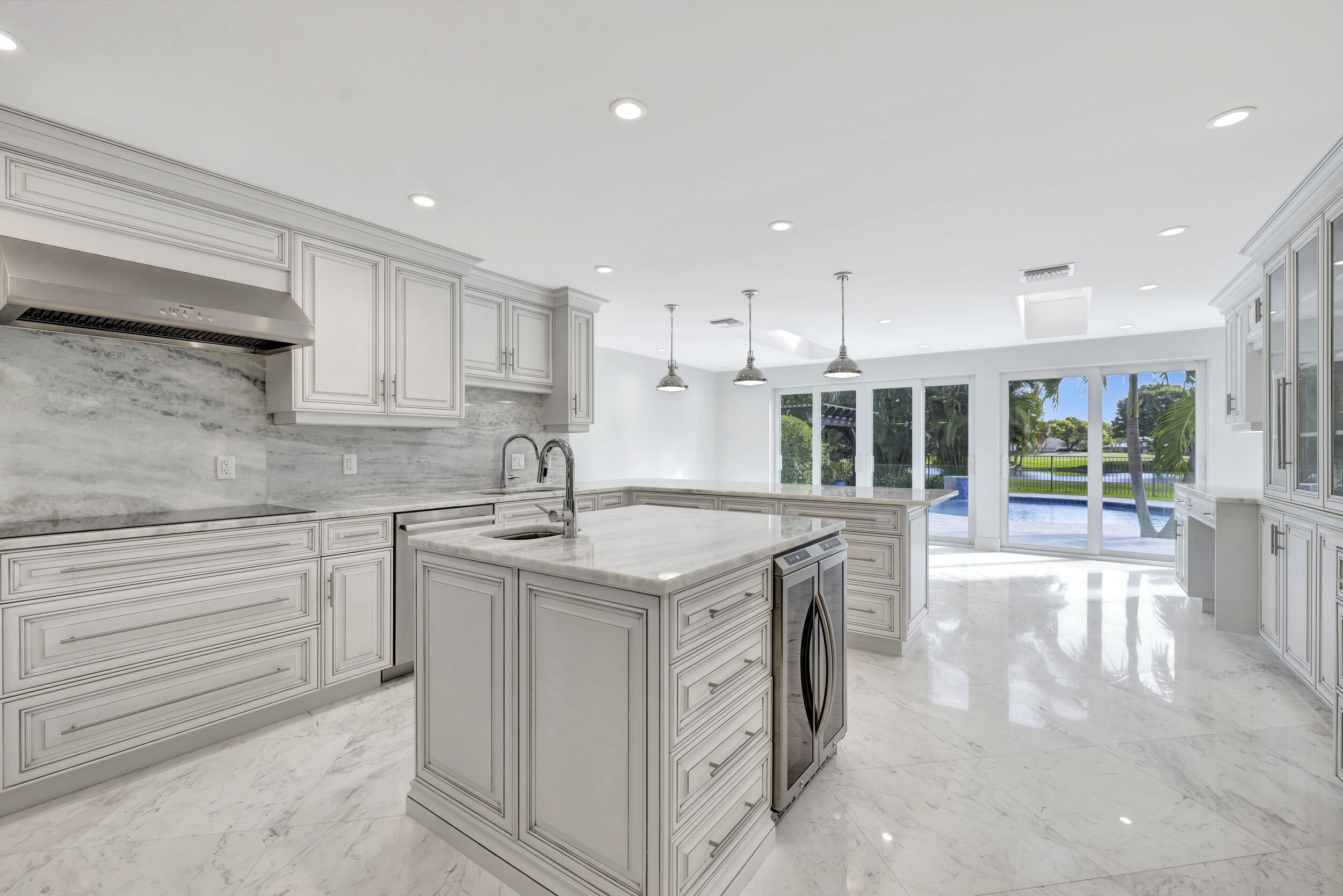 355 Oakview Drive Delray Beach, FL 33445 - Photo 57 of 92 a kitchen with a sink stove and cabinets