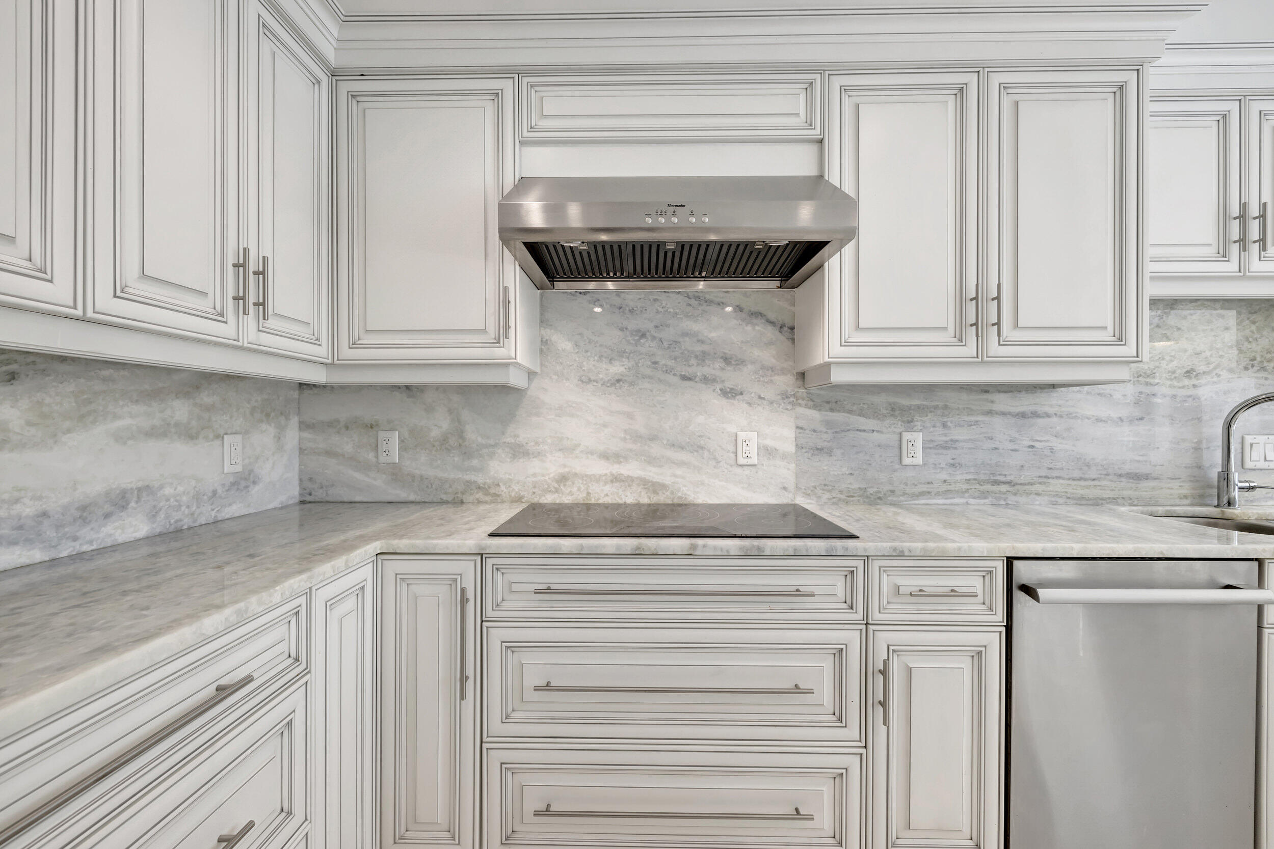 355 Oakview Drive Delray Beach, FL 33445 - Photo 59 of 92 a kitchen with granite countertop white cabinets and a sink