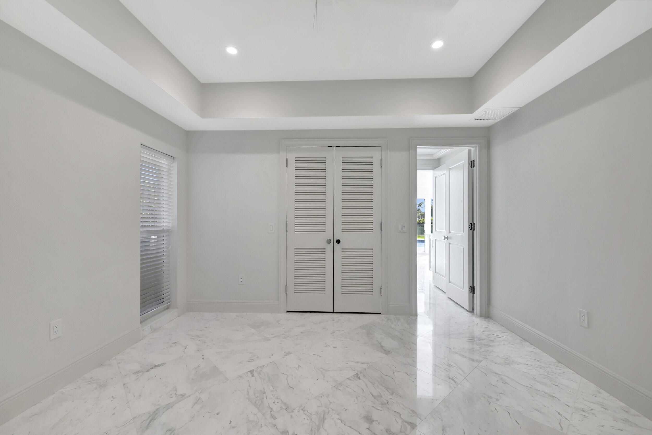 355 Oakview Drive Delray Beach, FL 33445 - Photo 68 of 92 an empty room with closet and wooden door