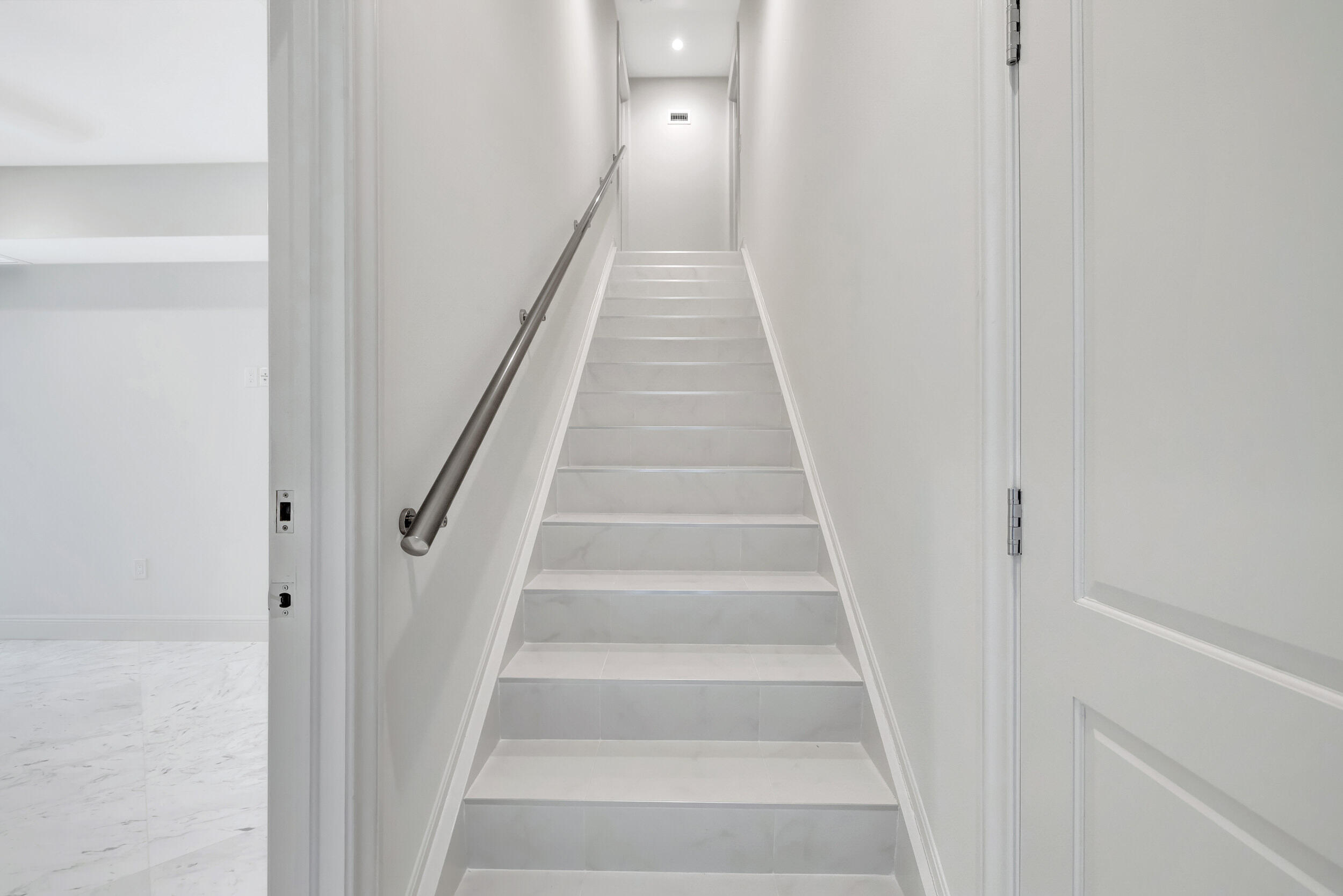 355 Oakview Drive Delray Beach, FL 33445 - Photo 69 of 92 a view of staircase with white walls and white door