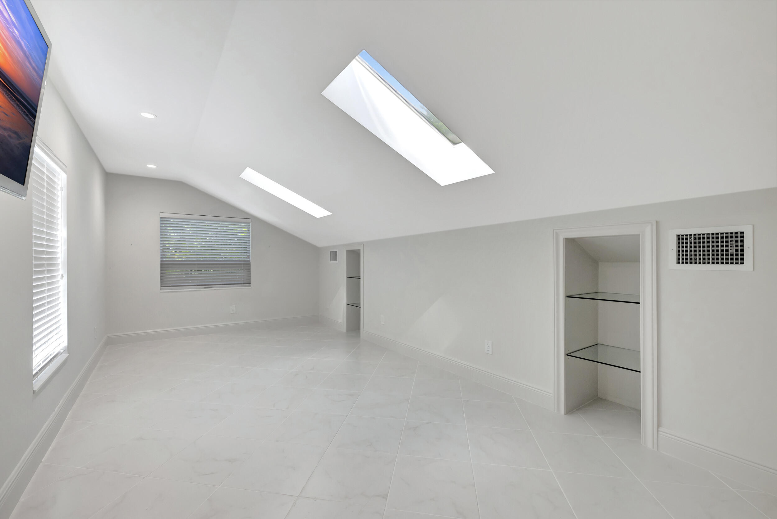 355 Oakview Drive Delray Beach, FL 33445 - Photo 70 of 92 an empty room with windows and cabinet