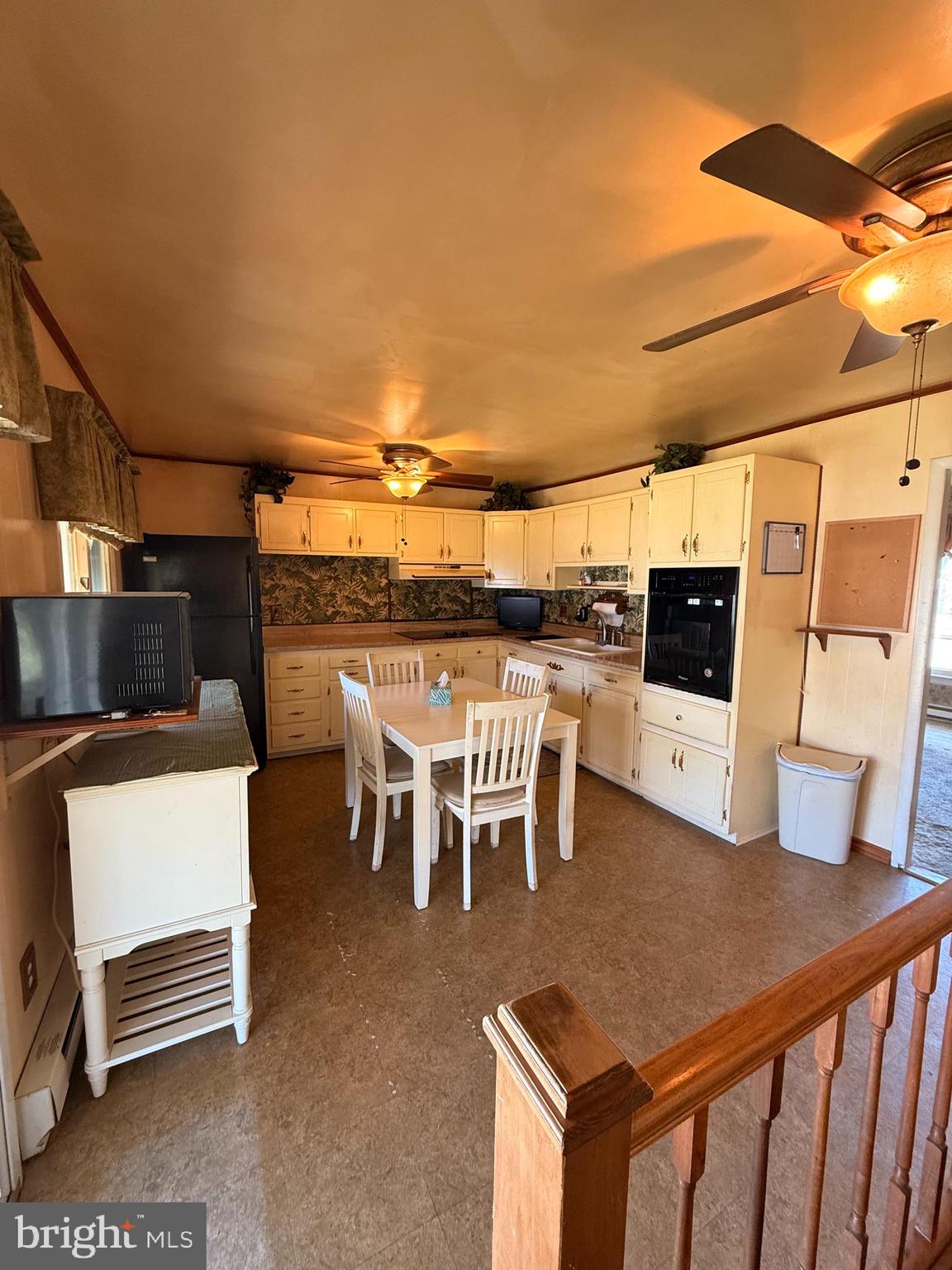 419 Iowa Avenue Delanco, NJ 08075 - Photo 11 of 14 a dining table with chairs and kitchen view