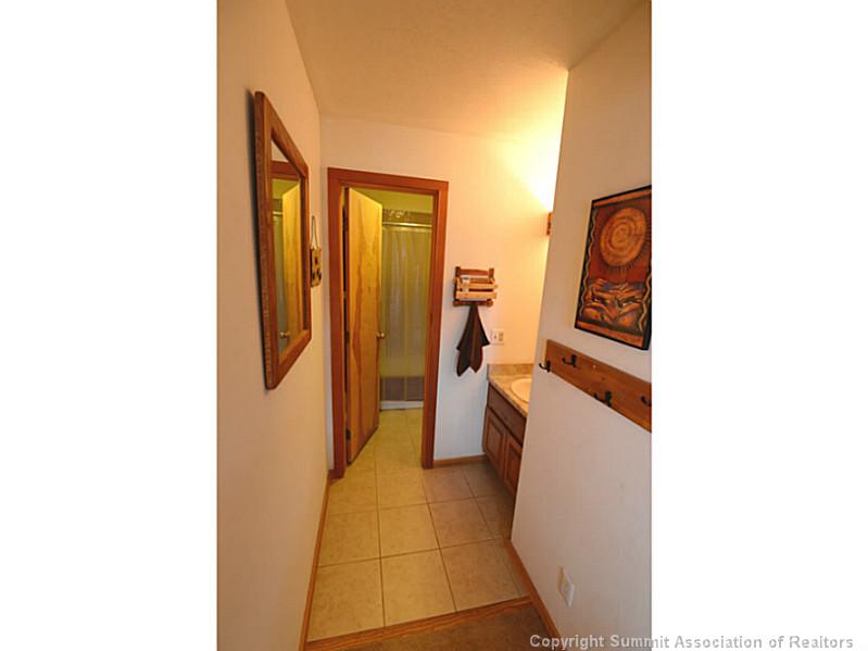 9460 Ryan Gulch Road, Unit 82 Silverthorne, CO 80498 - Photo 17 of 25 Bathroom. New floor tile in master bath.