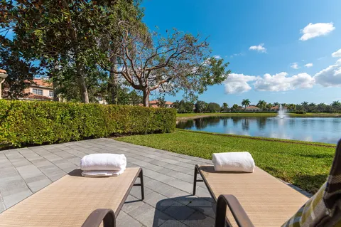 a view of a wooden deck and lake view